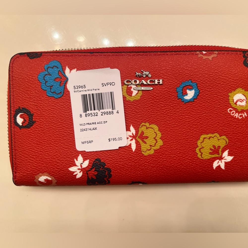 Brand new with tags beautiful red floral coach wallet.